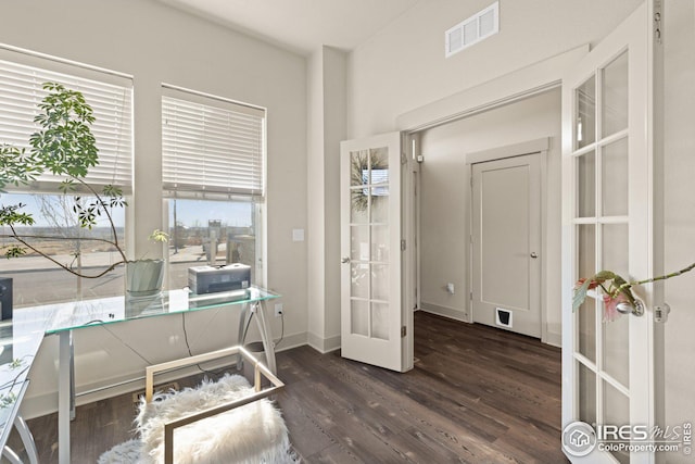 office featuring dark hardwood / wood-style floors and french doors