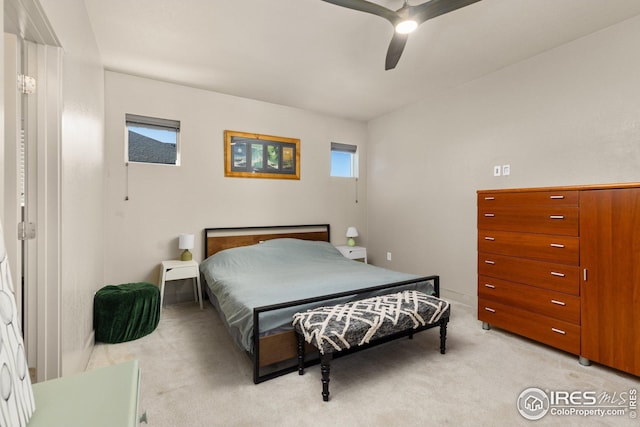 bedroom with light colored carpet and ceiling fan