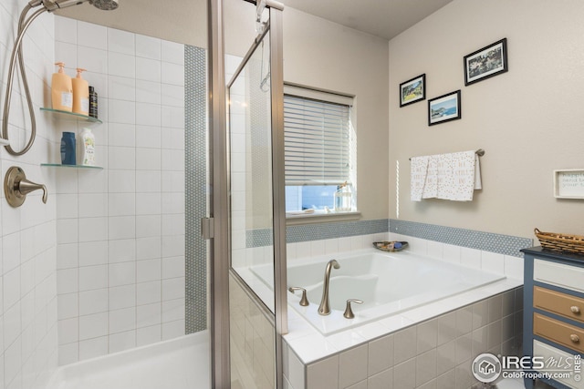 bathroom featuring shower with separate bathtub