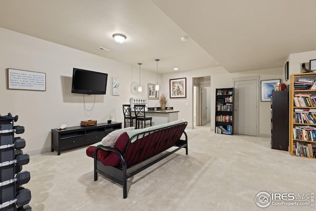 living room featuring light carpet