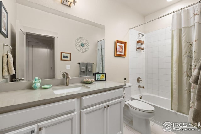 full bathroom featuring vanity, toilet, tile patterned flooring, and shower / tub combo