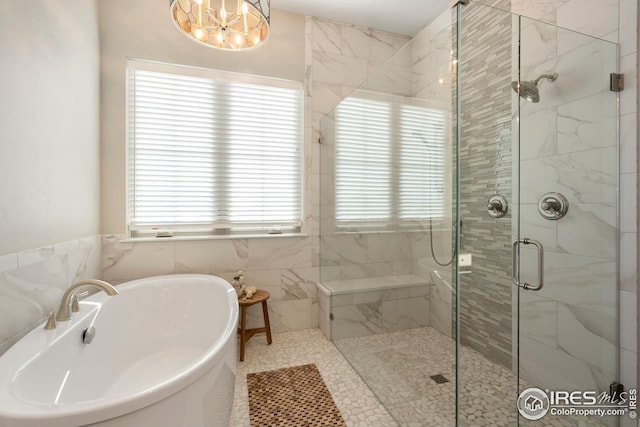 carpeted bedroom with a tray ceiling, an inviting chandelier, access to exterior, and baseboards