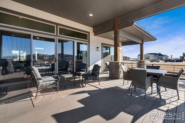 wooden deck with outdoor dining space