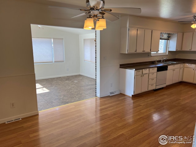 kitchen with ceiling fan, light hardwood / wood-style floors, dishwasher, and sink