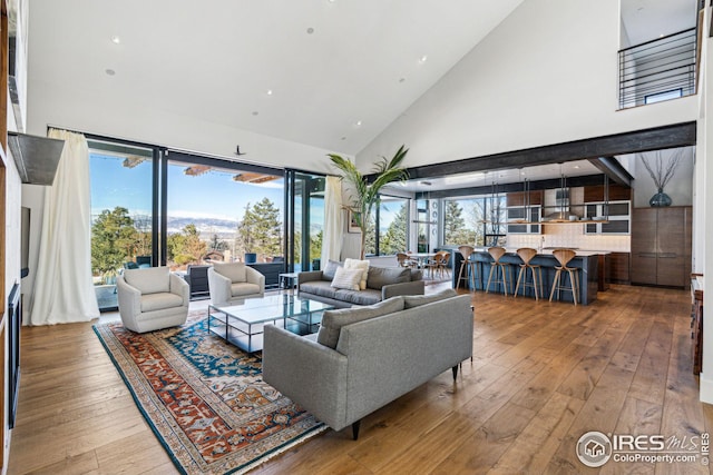 635 Paragon Dr, Boulder, CO 80303 - living room with high vaulted ceiling, wood-type flooring, and recessed lighting