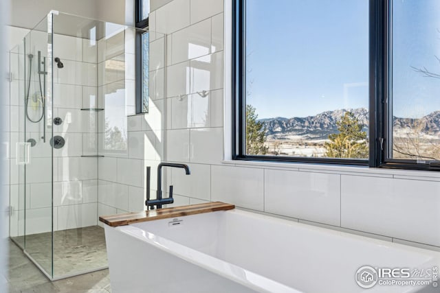 635 Paragon Dr, Boulder, CO 80303 - bathroom with a freestanding bath, a shower stall, and a mountain view