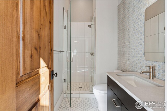 635 Paragon Dr, Boulder, CO 80303 - bathroom with a stall shower, vanity, and tile patterned flooring