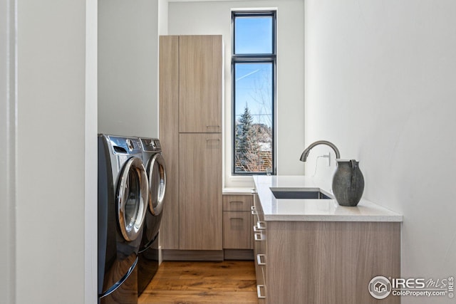 635 Paragon Dr, Boulder, CO 80303 - laundry room featuring independent washer and dryer and wood finished floors