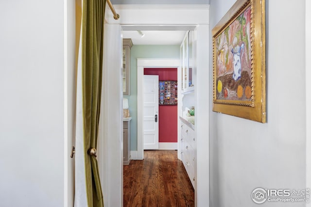 corridor featuring dark hardwood / wood-style flooring