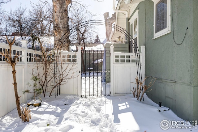 view of snow covered gate