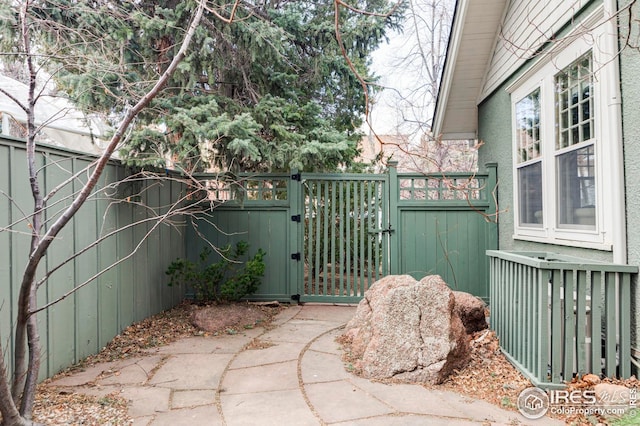view of patio / terrace featuring a gate and fence