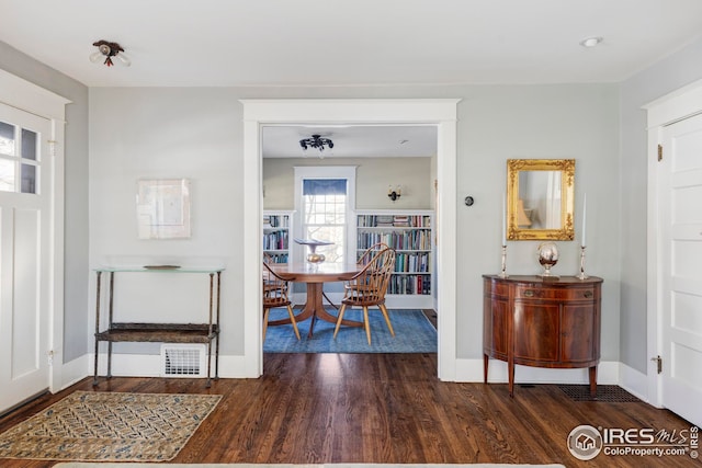 dining room with dark hardwood / wood-style flooring