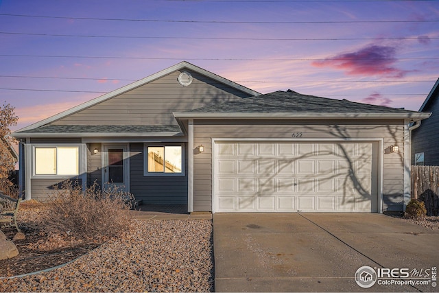 ranch-style house featuring a garage