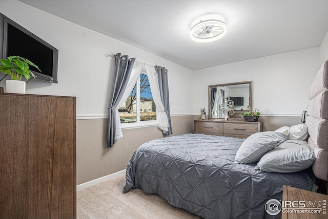 bedroom with light colored carpet