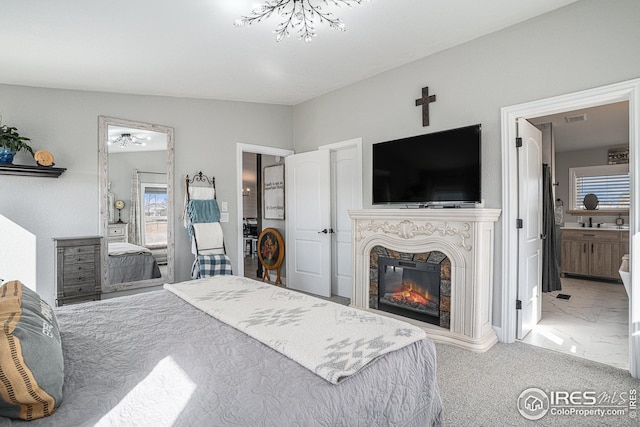 bedroom featuring carpet floors and ensuite bathroom