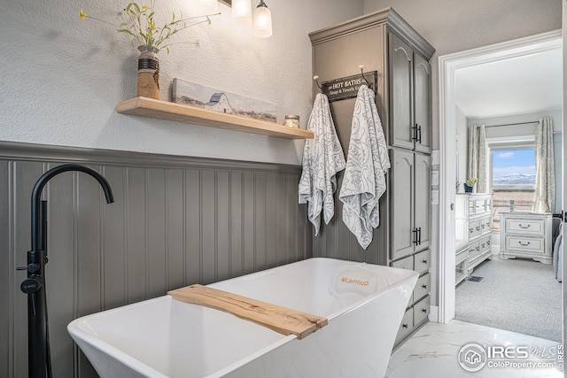 bathroom with a tub to relax in