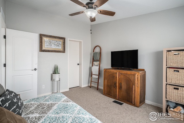 bedroom featuring light colored carpet and ceiling fan