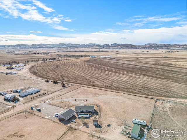 birds eye view of property featuring a mountain view