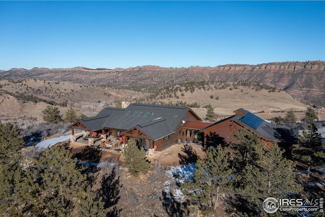 birds eye view of property with a mountain view