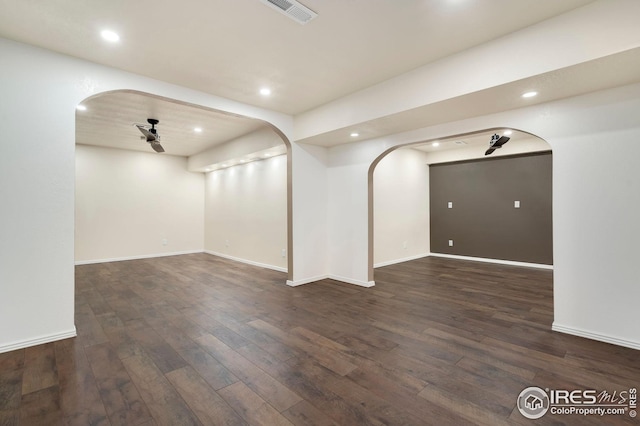 interior space featuring dark wood-type flooring and ceiling fan