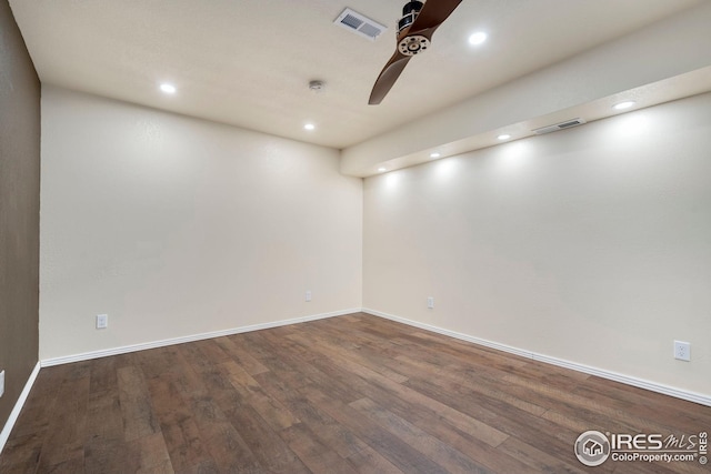 unfurnished room featuring ceiling fan and dark hardwood / wood-style flooring