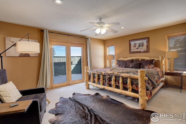 bedroom featuring access to exterior, light colored carpet, and ceiling fan