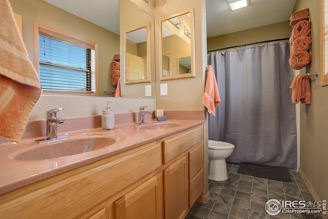 bathroom with vanity, curtained shower, tile patterned floors, and toilet