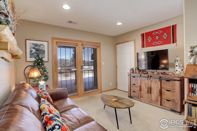 living room with french doors and carpet