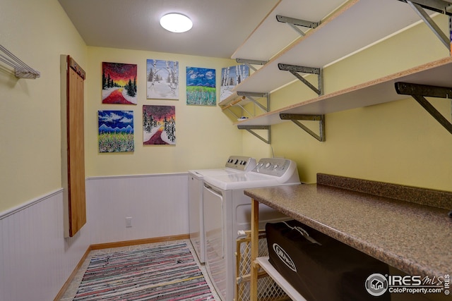 washroom featuring washer and clothes dryer