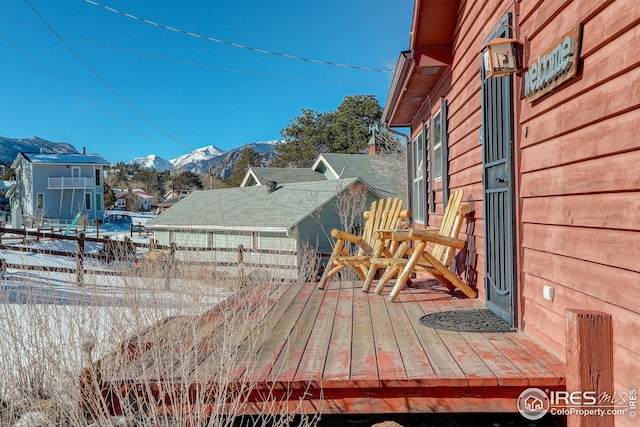 wooden deck with a mountain view