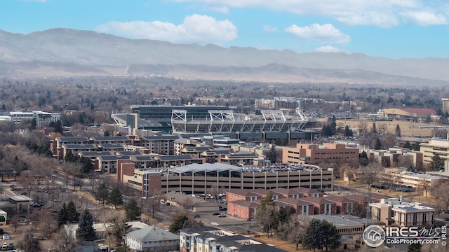 property's view of city with a mountain view