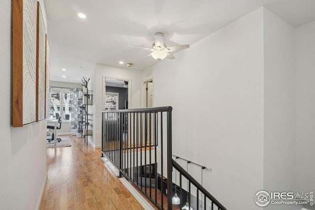 corridor with light hardwood / wood-style floors