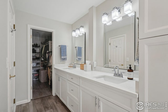 bathroom featuring hardwood / wood-style flooring and vanity