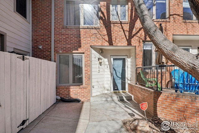 entrance to property featuring a patio