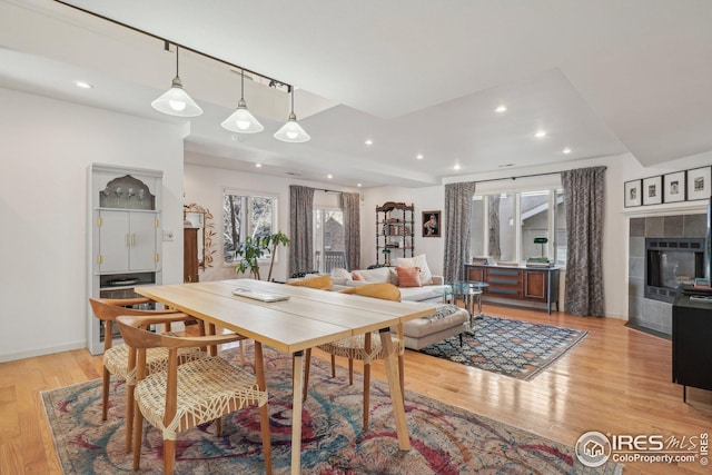 dining space featuring light wood-type flooring