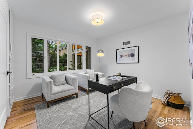 office space featuring hardwood / wood-style floors