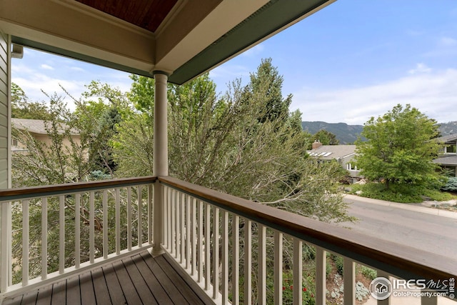 wooden deck with a mountain view