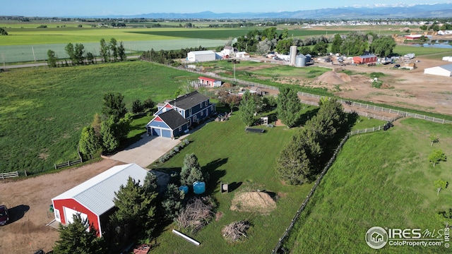 birds eye view of property featuring a mountain view and a rural view