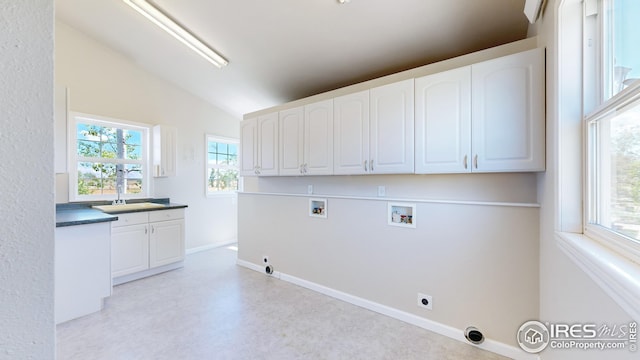 washroom featuring sink, electric dryer hookup, cabinets, washer hookup, and hookup for a gas dryer