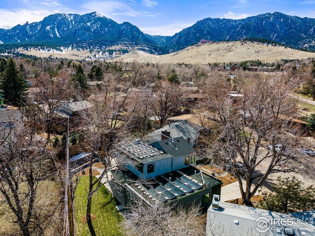 birds eye view of property featuring a mountain view