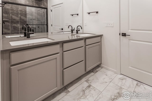 bathroom featuring vanity and an enclosed shower