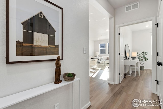 hallway featuring light hardwood / wood-style flooring