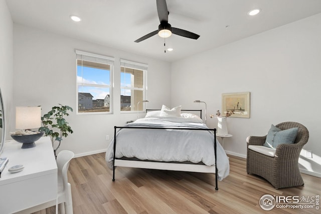 bedroom featuring light hardwood / wood-style floors and ceiling fan