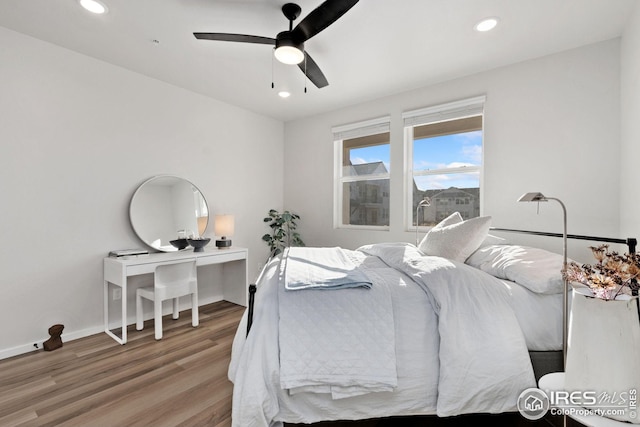 bedroom featuring wood-type flooring and ceiling fan