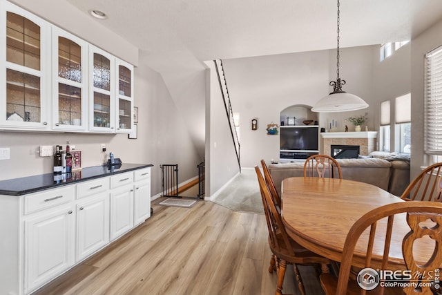 dining space with plenty of natural light and light hardwood / wood-style flooring