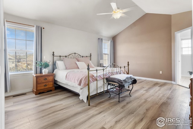 bedroom featuring lofted ceiling, light hardwood / wood-style floors, and ceiling fan