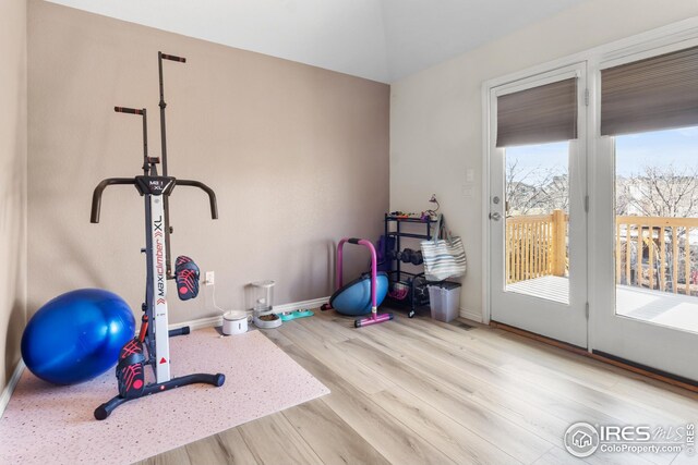 exercise area with light hardwood / wood-style floors