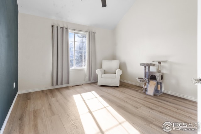 unfurnished room with lofted ceiling, ceiling fan, and light wood-type flooring