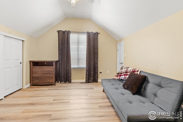 sitting room with vaulted ceiling, ceiling fan, and light hardwood / wood-style floors
