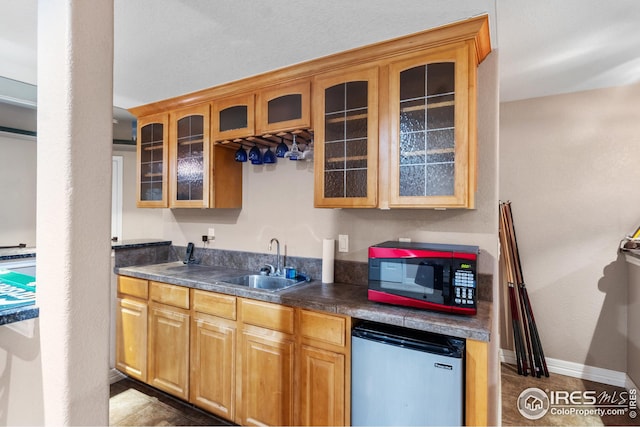kitchen with fridge and sink
